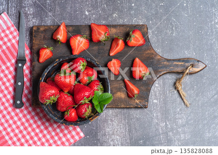 Strawberries On Wooden Cutting Board With Knife Strawberries On Wooden Cutting Board With Knife 135828088