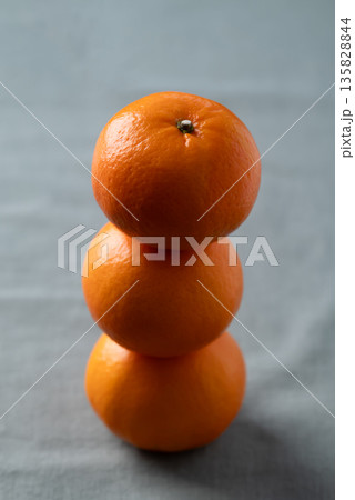 Mandarin tangerine orange fruit on fabric background Mandarin tangerine orange fruit on fabric background 135828844