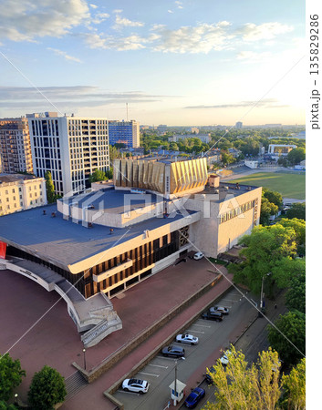 A large fundamental building from the Soviet period. A large wide building with a flat roof built during the Soviet era A large fundamental building from the Soviet period. A large wide building with a flat roof built during the Soviet era 135829286