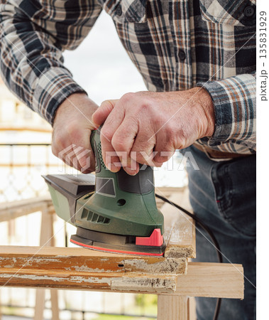 Carpenter at work, restoring an old wooden window. Carpentry. Carpenter at work, restoring an old wooden window. Carpentry. 135831929