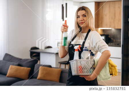 Female professional cleaning service worker is domestic room Female professional cleaning service worker is domestic room 135832781