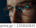 Stock market chart reflected in traders glasses  135832835
