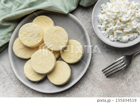 Frozen cottage cheese pancakes ready for cooking 135834519