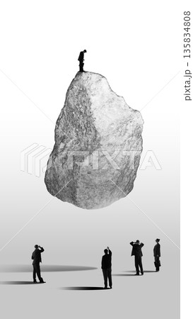 Graphic composition of businessman standing on massive stone above observing group. Collage of 3 models 135834808