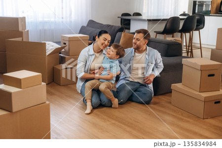 Finally some rest. Family of husband, wife and son are moving into new house 135834984
