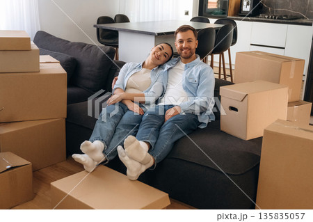 Success, resting. Happy couple moved into new house Success, resting. Happy couple moved into new house 135835057