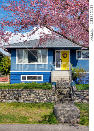 Average single family house with front yard on land terrace. Average single family house with front yard on land terrace. 135835138