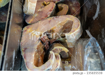 Frozen Salmon Fillets With Skins, Ice Crystals, and Bright Orange Flesh Texture Frozen Salmon Fillets With Skins, Ice Crystals, and Bright Orange Flesh Texture 135835539