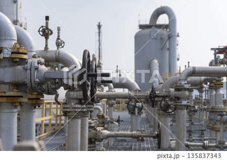 Large industrial plant with many pipes and valves 135837343