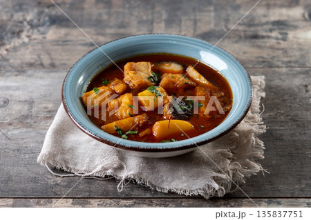 Cod with potatoes on wooden table 135837751