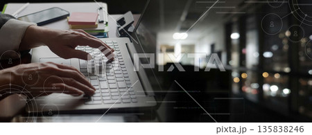 Working late in a quiet office. Working late in a quiet office. 135838246