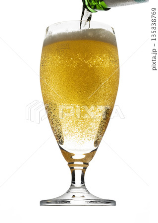 Pouring Beer into Glass Pouring Beer into Glass 135838769