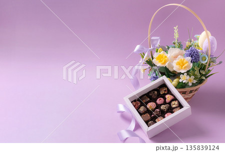 Easter chocolate gift box and spring flower basket Easter chocolate gift box and spring flower basket 135839124