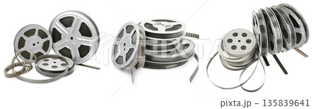 Vintage Metal Film Reels with Unwound Motion Picture Film Isolated on White Background 135839641