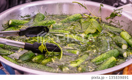 Pickled cucumbers in dill brine pot 135839891