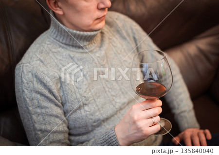 man drinking wine and relaxing 135840040