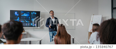 Science teacher teaching in high school classroom. Science teacher teaching in high school classroom. 135840767