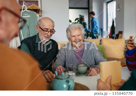 Old people spending time together in community center. 135840770