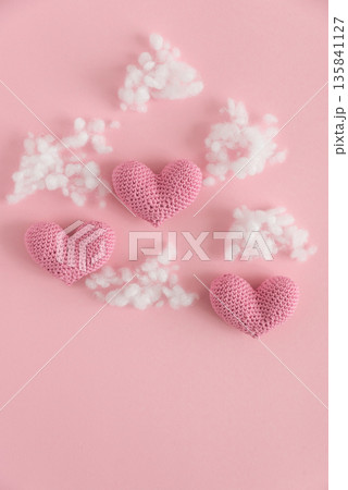 Crocheted Hearts with Yarn and Stuffing. Handmade Valentines Day Craft Flatlay Crocheted Hearts with Yarn and Stuffing. Handmade Valentines Day Craft Flatlay 135841127