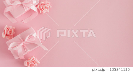 Pink Gift Boxes and Roses. Romantic Valentines or Mothers Day Flatlay on Soft Pink Background Pink Gift Boxes and Roses. Romantic Valentines or Mothers Day Flatlay on Soft Pink Background 135841130