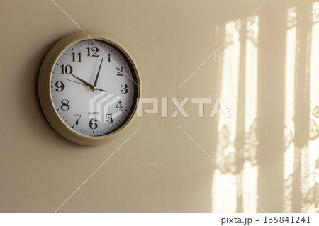 Clock on wall at home showing ten hours Clock on wall at home showing ten hours 135841241