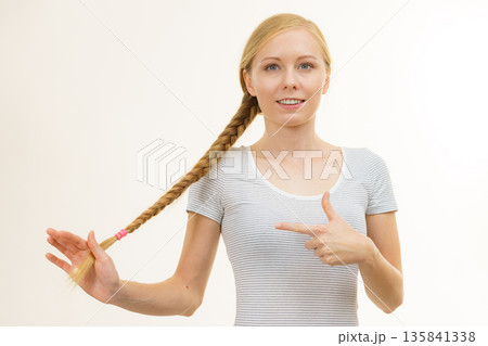 Blonde young woman with braid hair Blonde young woman with braid hair 135841338