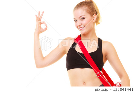 Sport. Fitness girl with gym bag showing ok hand sign Sport. Fitness girl with gym bag showing ok hand sign 135841441