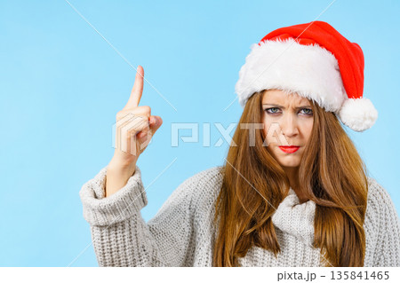 Woman threatens with finger, serious face expression Woman threatens with finger, serious face expression 135841465