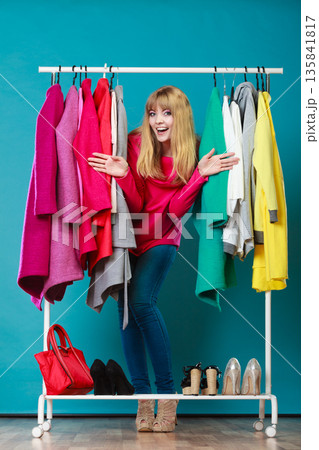 Woman choosing clothes in mall or wardrobe Woman choosing clothes in mall or wardrobe 135841817