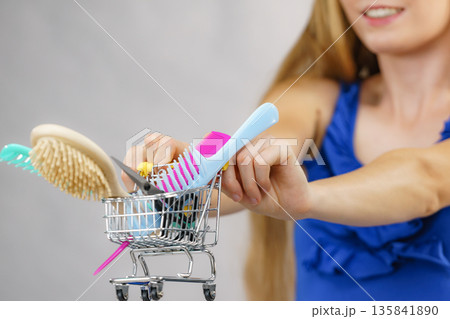 Girl with hair accessories in shopping cart 135841890
