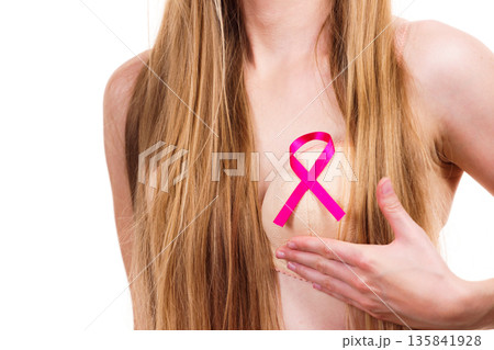Woman chest in bra, pink cancer ribbon 135841928