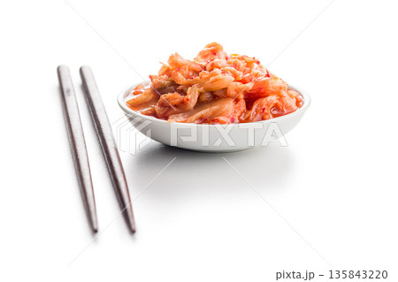 Fermented cabbage. Kimchi. Korean food in bowl isolated on white background. 135843220