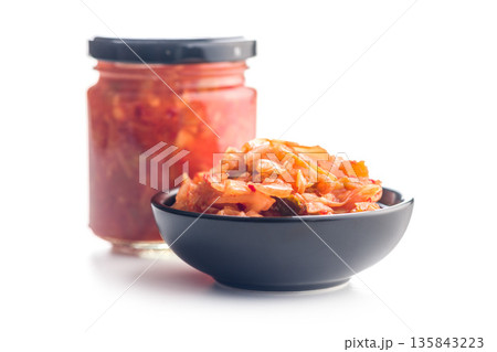 Fermented cabbage. Kimchi. Korean food in bowl isolated on white background. Fermented cabbage. Kimchi. Korean food in bowl isolated on white background. 135843223