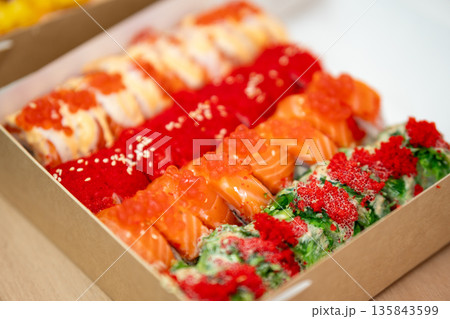 Assorted colorful sushi roll selection with salmon, caviar and seaweed salad 135843599