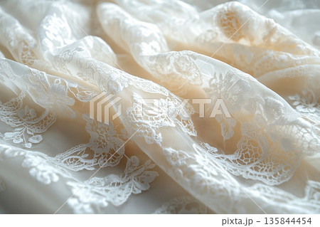 Attract fashion brands. Diversity samples of a handmade French lace draped hanging on a white background. 135844454