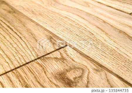 Several planks of beautiful laminate or parquet flooring with wooden texture as background Several planks of beautiful laminate or parquet flooring with wooden texture as background 135844735