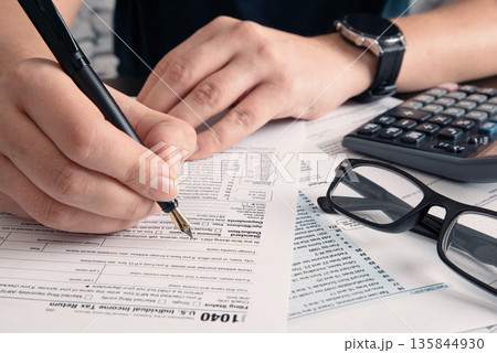 Tax return concept wits US 1040 tax form Tax return concept wits US 1040 tax form 135844930