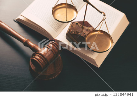 Judge gavel on a wooden desk Judge gavel on a wooden desk 135844941