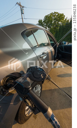 A car is being filled with gas A car is being filled with gas 135846238