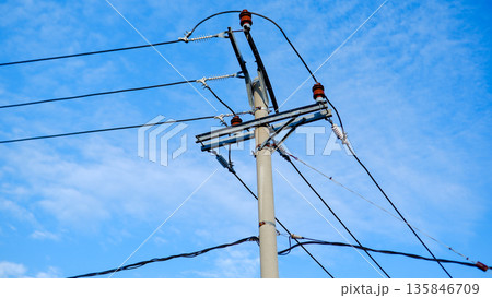 Utility Pole with Porcelain Insulators and High Voltage Power Lines Utility Pole with Porcelain Insulators and High Voltage Power Lines 135846709