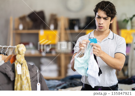 In chain shop, man choose ladys lingerie panties 135847921