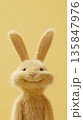 Smiling fluffy bunny on sunny yellow background 135847976
