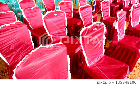 Elegant Red Wedding Chairs with White Lace Covers Elegant Red Wedding Chairs with White Lace Covers 135848100