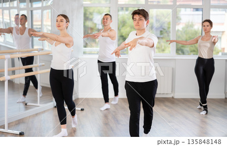 Group of dancers rehearsing ballet dance Group of dancers rehearsing ballet dance 135848148
