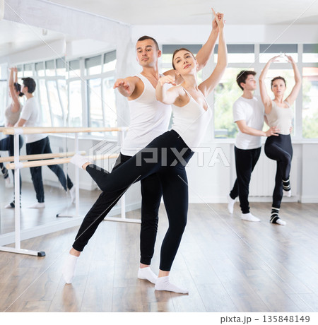 Young man and young woman rehearsing pair ballet Young man and young woman rehearsing pair ballet 135848149