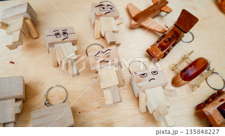 Unique Wooden Character Keychains with Hand Drawn Facial Expressions 135848227