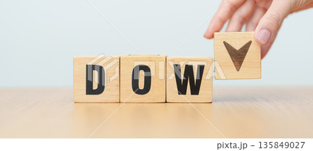 Hand change wooden block of Dow Jones Index text to UP and Down arrow symbol icon. stock market index, trade, trade company in the United States, financial growth and Cut loss concept Hand change wooden block of Dow Jones Index text to UP and Down arrow symbol icon. stock market index, trade, trade company in the United States, financial growth and Cut loss concept 135849027