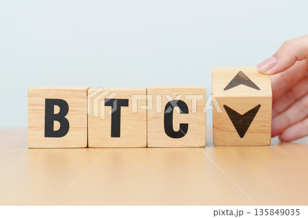 Hand change Wooden block with BTC or Bitcoin text to UP and Down arrow symbol. cryptocurrency, blockchain, price, down and up, decrease and increase, cut loss, trade and financial concepts 135849035