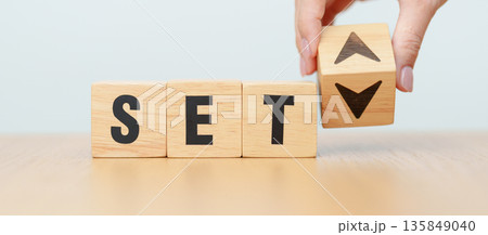Hand change wooden block with SET text or The Stock Exchange of Thailand to UP and Down arrow symbol icon. decrease and increase, price, stocks, financial, trade, value and Cut loss concept Hand change wooden block with SET text or The Stock Exchange of Thailand to UP and Down arrow symbol icon. decrease and increase, price, stocks, financial, trade, value and Cut loss concept 135849040