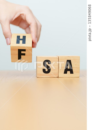 hand change wooden block from FSA to HSA. Flexible Spending Account and Health Savings Account, Medical Expenses, Tax Benefits and healthcare concepts 135849068